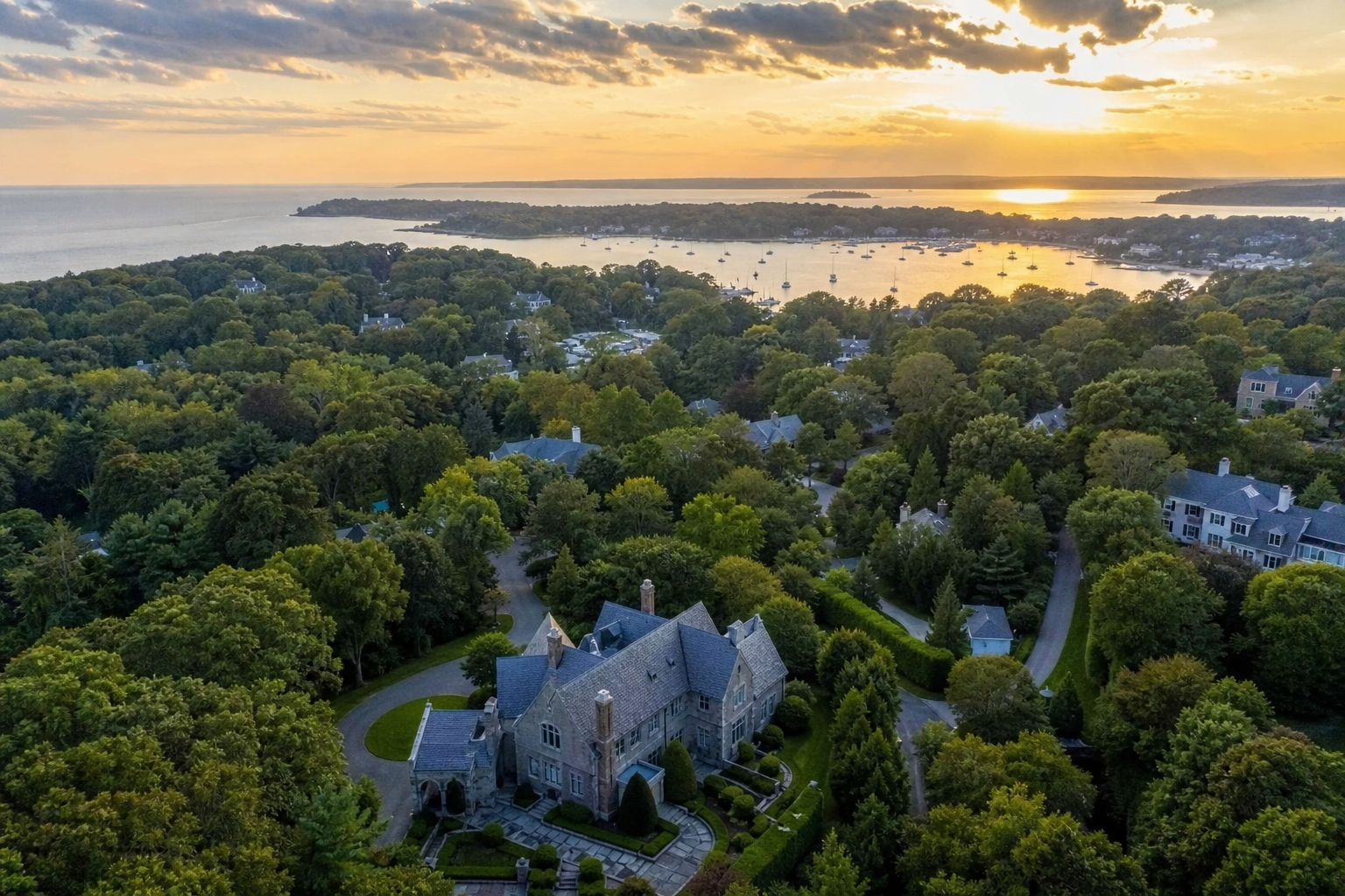 An aerial view of a wooded North Shore Long Island village at sunset